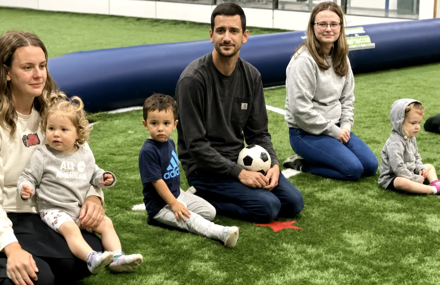 Coach working with young soccer players