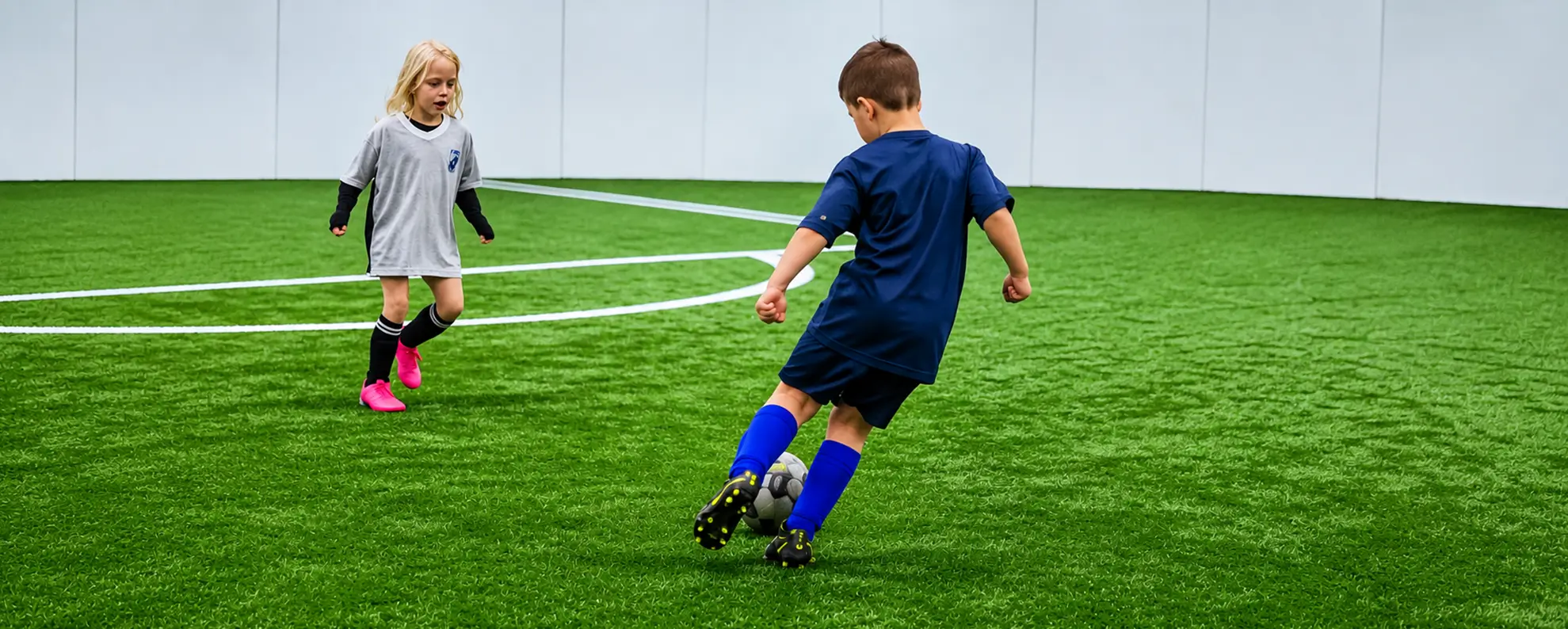 Young soccer players developing their footskills during an indoor clinic