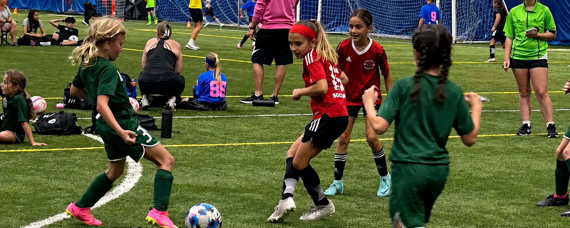 Youth soccer players competing inside Rossford Dome