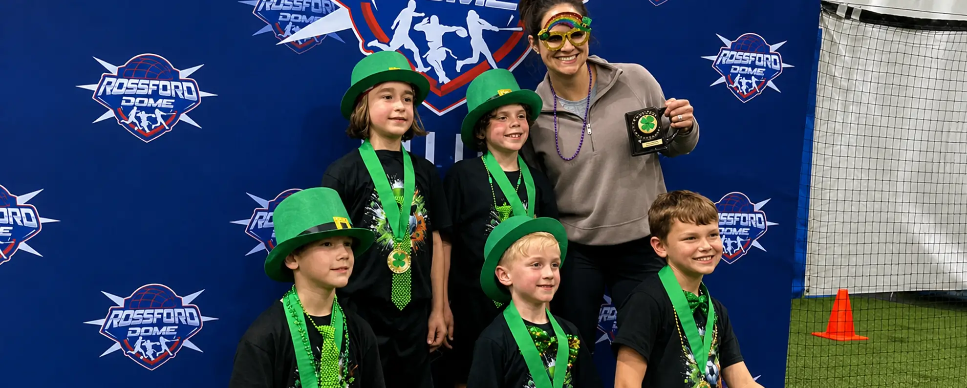 St. Patty's tournament players celebrating with medals at Rossford Dome